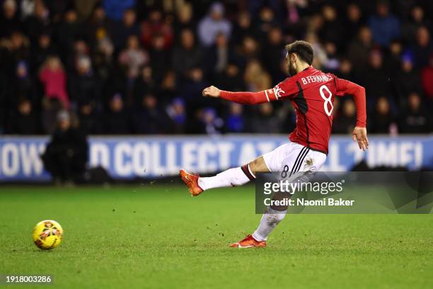Bruno Fernandes of Manchester United scores his team's second goal from the penalty spot during the Emirates FA Cup Third Round match between Wigan...