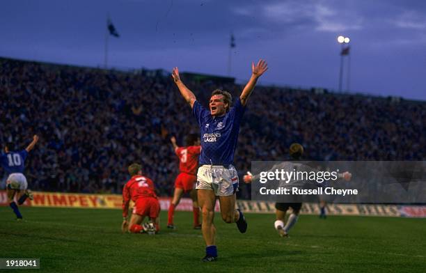 Robert Fleck of Rangers raises his arms in jubilation as he scores during the Skol Cup final match between Rangers and Aberdeen at Hampden Park in...