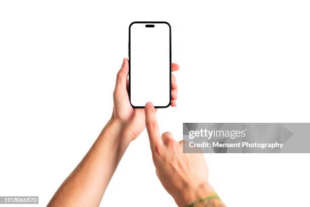 hand holding smartphone mockup with blank white screen and touching screen isolated on white background - hand holding phone stock pictures, royalty-free photos & images