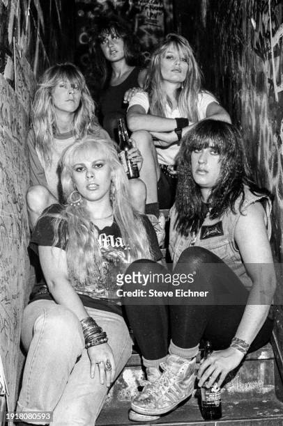 Members of American Heavy Metal band Wench pose on a staircase at CBGB, New York, New York, August 1, 1988. , New York, New York, August 1, 1988....