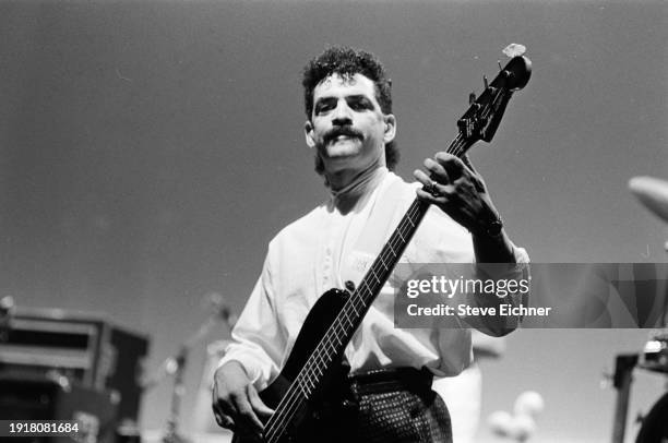 American Rock musician Kenny Gradney, of band Little Feat, plays bass guitar as he performs on stage at the Beacon Theatre, New York, New York,...