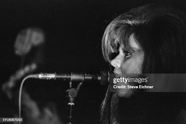 Close-up of American New Wave musician Kate Pierson as she performs on stage with the band the B-52's at the Fillmore West, San Francisco,...