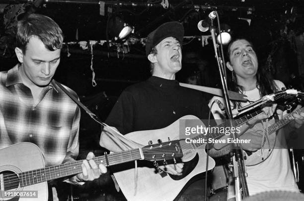 American Alternative Rock musicians, from left, David Lowery & Greg Lisher, both on acoustic guitars, and Jonathan Segel, on mandolin, perform...