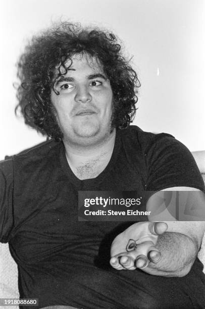 View of American Rock musician John Popper, of the band Blues Traveler, in his Brooklyn home, New York, New York, March 1, 1990.