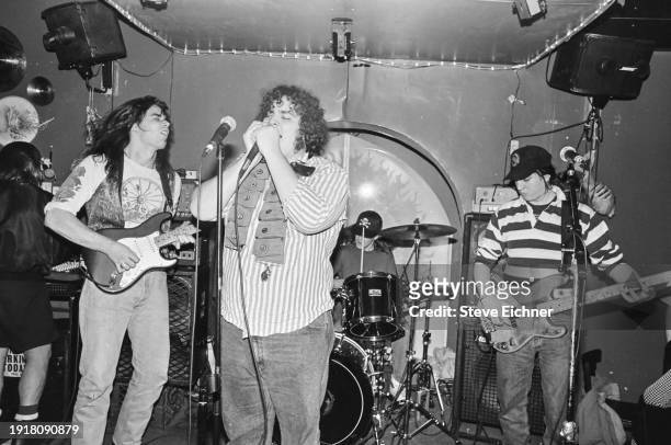 Members of American Rock band Blues Traveler perform on stage at Mondo Perso, New York, New York, March 10, 1990. Pictured are, from left, Chan...