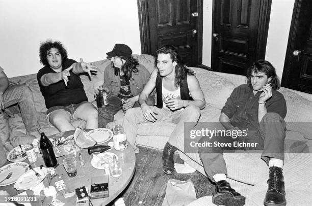 View of the members of American Rock band Blues Traveler in their Brooklyn home, New York, New York, March 1, 1990. Pictured are, from left, John...