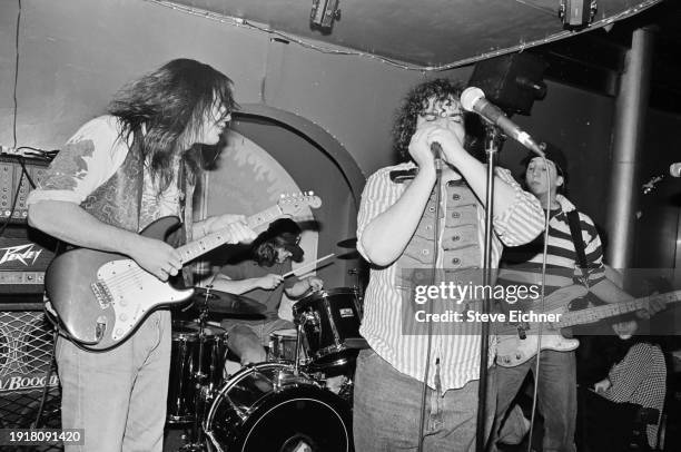 Members of American Rock band Blues Traveler perform on stage at Mondo Perso, New York, New York, March 10, 1990. Pictured are, from left, Chan...