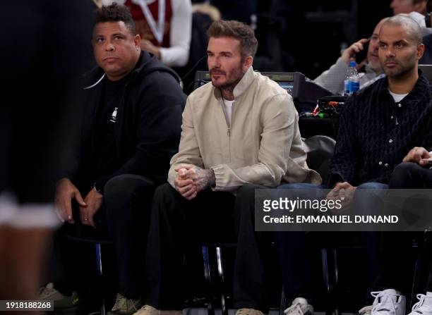 Former football players Ronaldo from Brazil and David Beckham form England and French former basketball player Tony Parker attend the NBA regular...