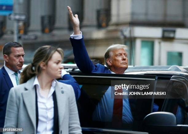 Former US President Donald Trump departs after speaking to the press after attending the civil fraud trial against the Trump Organization in New York...