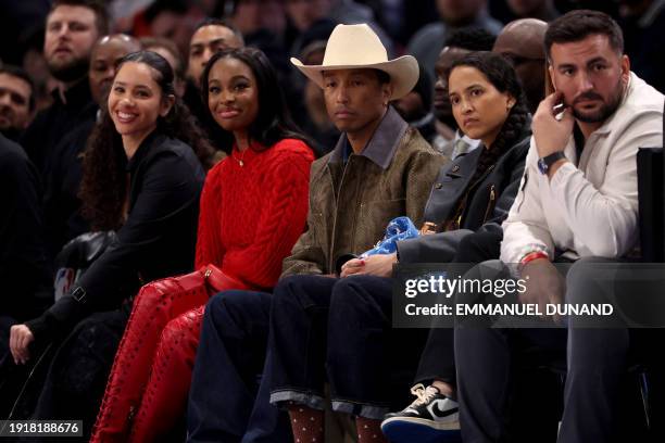 American singer Courtney Michaela aka Coco Jones , US musician Pharrell Williams , attend the NBA regular season basketball match between the...