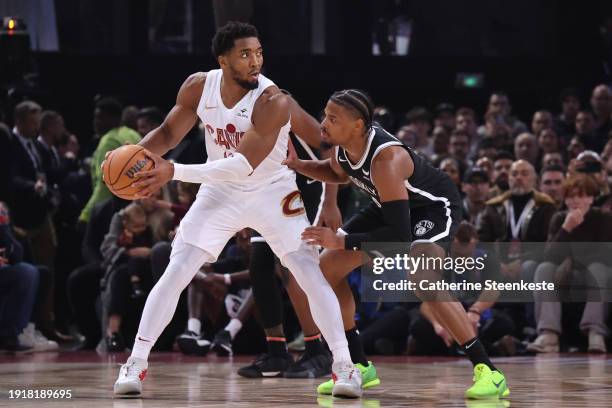 Donovan Mitchell of the Cleveland Cavaliers handles the ball during the game against the Brooklyn Nets on January 1, 2024 at The Accor Arena in...