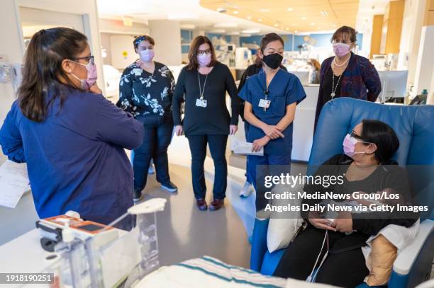 Los Angeles, CA Johanna Farias holds her son Ricky as the NICU team makes their rounds at Providence Cedars-Sinai Tarzana Medical Center's Neonatal...