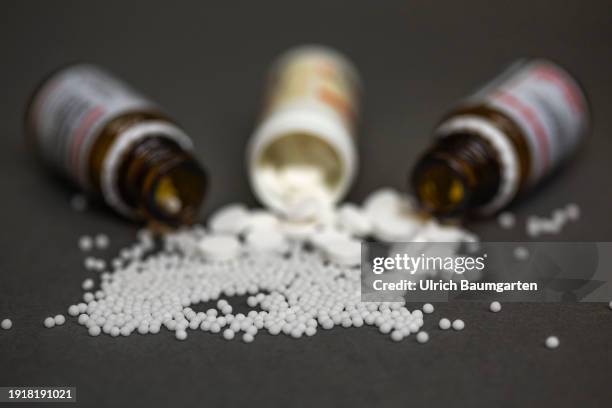 The illustration photo shows medicine bottles with homeopathic pills and tablets on January 11, 2024 in Bonn, Germany. Homeopathic services will...