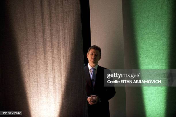 Colombian presidential candidate for the ruling National Unity party, Juan Manuel Santos is seen before a debate with the presidential candidate for...