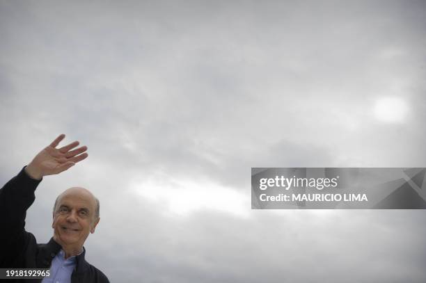 Brazil's presidential candidate Jose Serra, for the Brazilian Social Democratic Party , gestures to supporters during a campaign rally in the...