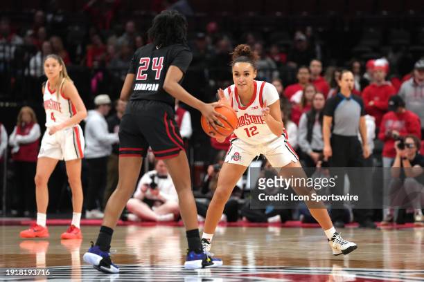 Celeste Taylor of the Ohio State Buckeyes guards Lisa Thompson of the Rutgers Scarlet Knights during the game at Value City Arena in Columbus, Ohio...