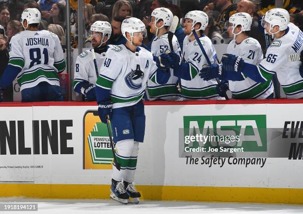 Elias Pettersson of the Vancouver Canucks celebrates his goal with teammates during the first period against the Pittsburgh Penguins at PPG PAINTS...