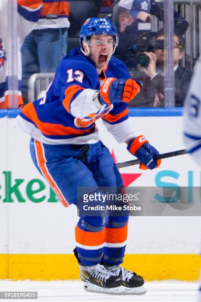 Mathew Barzal of the New York Islanders celebrates after scoring the game-winning goal in overtime against the Toronto Maple Leafs at UBS Arena on...