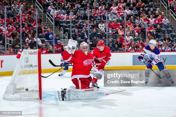 Darnell Nurse of the Edmonton Oilers makes the game winning goal on goalie Alex Lyon of the Detroit Red Wings in overtime at Little Caesars Arena...