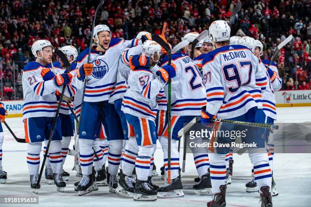Darnell Nurse of the Edmonton Oilers celebrates his game winning overtime goal with teammates against the Detroit Red Wings at Little Caesars Arena...