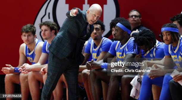 Mick Cronin head coach of the UCLA Bruins talks to his bench during the first half of their game against the Utah Utes at the Jon M Huntsman Center...