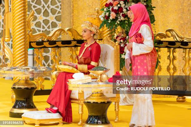 This picture taken on January 10, 2024 shows Brunei's Prince Abdul Mateen's bride Yang Mulia Anisha Rosnah during the royal powdering ceremony at...