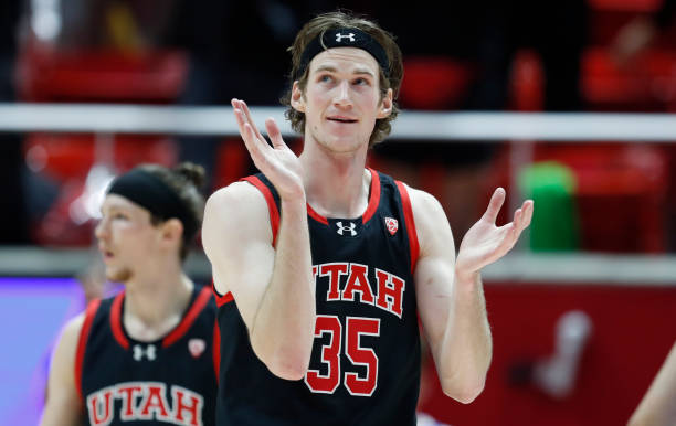 Branden Carlson of the Utah Utes claps after a score against the UCLA Bruins during the second half of their game at the Jon M Huntsman Center on...