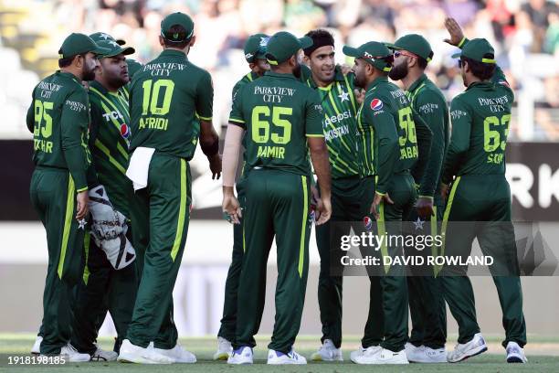 Pakistan's players celebrate the wicket of New Zealand's Finn Allen during the first Twenty20 international cricket match between New Zealand and...