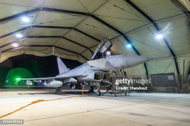 In this handout image provided by the UK Ministry of Defence, an RAF Typhoon aircraft returns to berth following a strike mission on Yemen's Houthi...