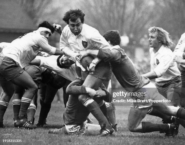 Jean-Luc Joinel of France is tackled as he is supported by teammate Jean-Pierre Rives during the Five Nations Championship match between Ireland and...