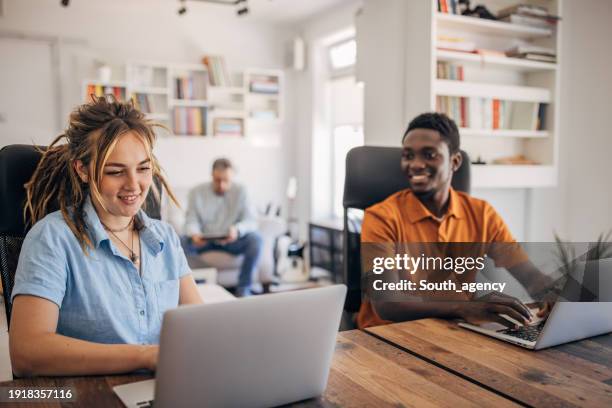 colleagues talking in office - gender diversity stock pictures, royalty-free photos & images