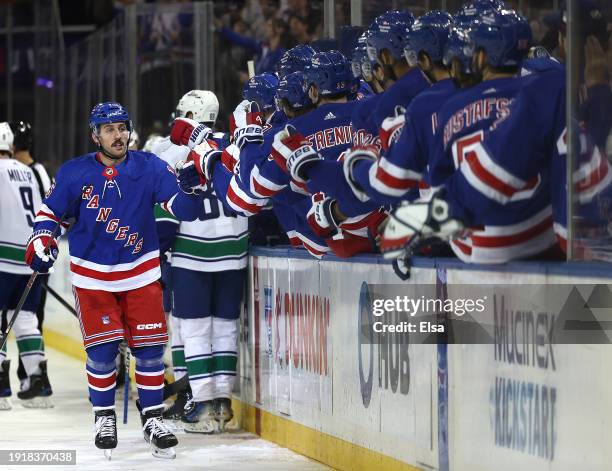 Vincent Trocheck of the New York Rangers celebrates his goal with teammates on the bench during the first period against the Vancouver Canucks at...