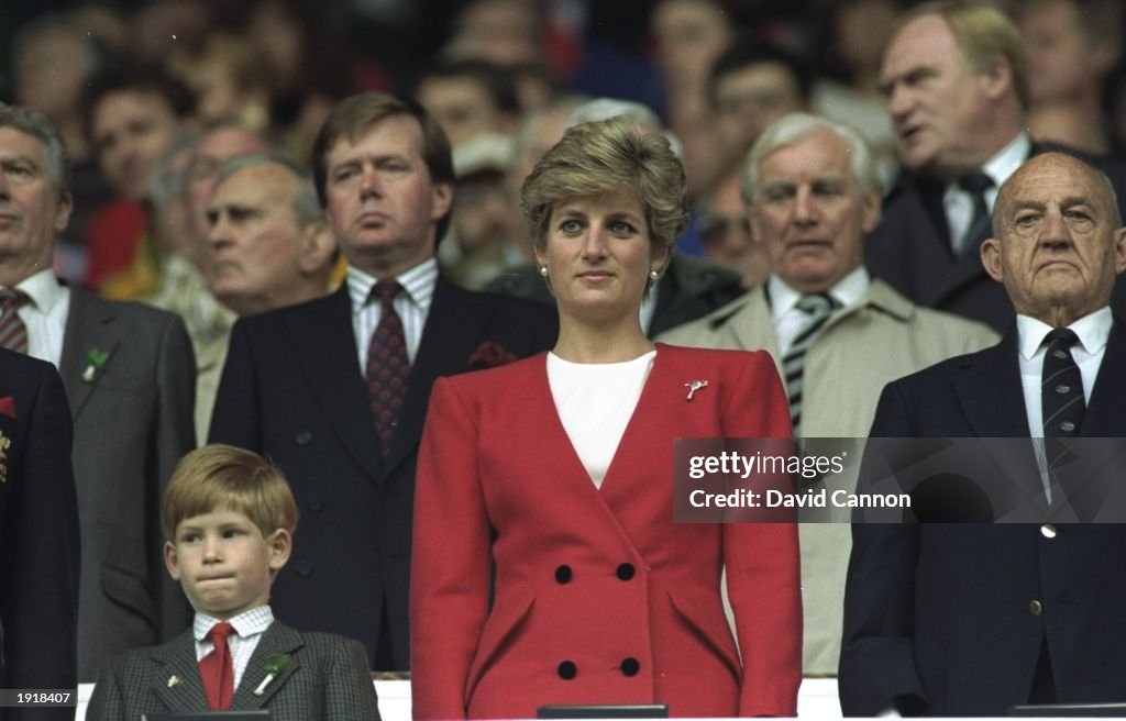 HRH Princess Diana and HRH Prince Harry stand for the National Anthem at the Wales V Australia match