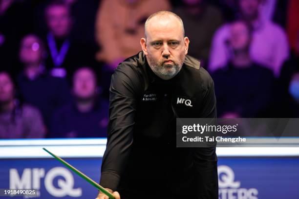 Mark J Williams of Wales reacts in the first round match against Ali Carter of England on day 2 of the 2024 MrQ Masters Snooker at Alexandra Palace...
