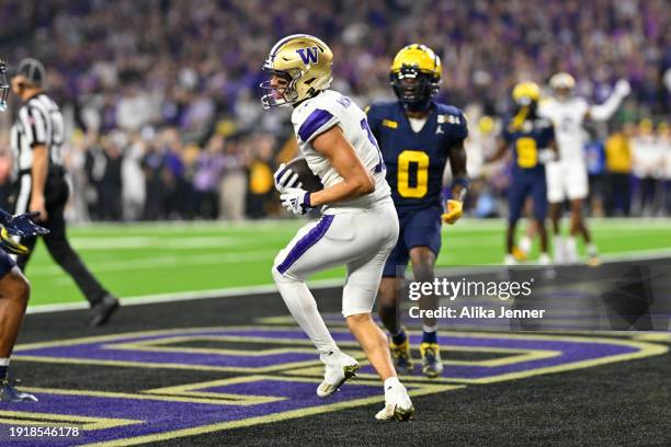 Jalen McMillan of the Washington Huskies scores a touchdown during the second quarter of the 2024 CFP National Championship game against the against...
