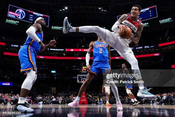 Kyle Kuzma of the Washington Wizards pulls in a rebound against the Oklahoma City Thunder at Capital One Arena on January 08, 2024 in Washington, DC....