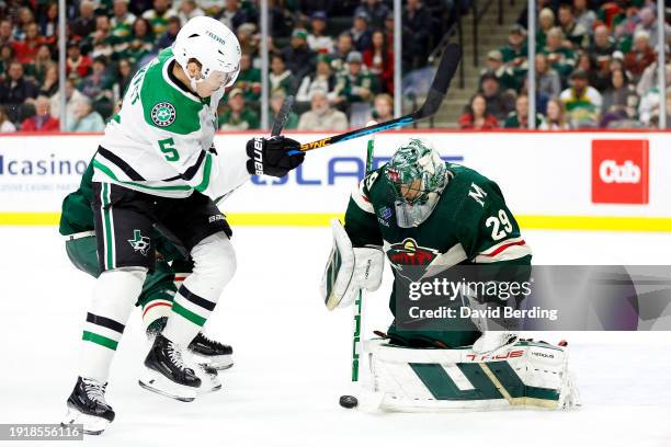 Marc-Andre Fleury of the Minnesota Wild makes a save against Nils Lundkvist of the Dallas Stars in the second period at Xcel Energy Center on January...