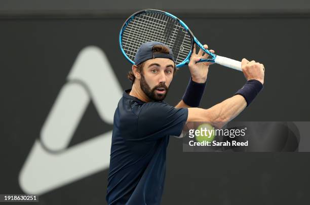 Jordan Thompson of Australia plays a backhand during their match against Facundo Diaz Acosta of Argentina in the 2024 Adelaide International at...