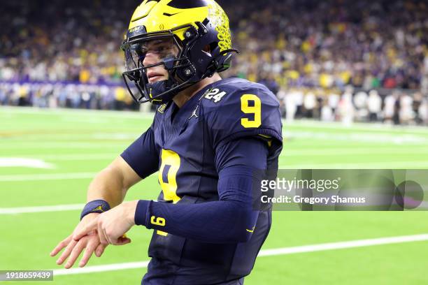 McCarthy of the Michigan Wolverines reacts after a touchdown in the fourth quarter against the Washington Huskies during the 2024 CFP National...