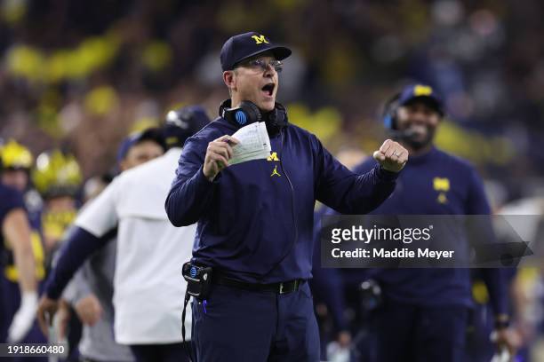 Head coach Jim Harbaugh of the Michigan Wolverines reacts after a touchdown in the fourth quarter against the Washington Huskies during the 2024 CFP...
