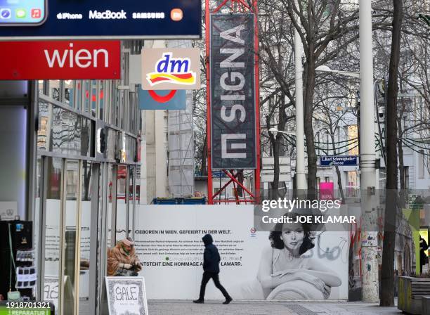 Pedestrian walks past the construction site of Signa's financed Lamarr luxury department store, named after the Vienna-born Hollywood diva Hedy...