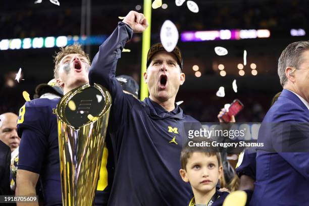 McCarthy and Head coach Jim Harbaugh of the Michigan Wolverines celebrate after defeating the Washington Huskies during the 2024 CFP National...