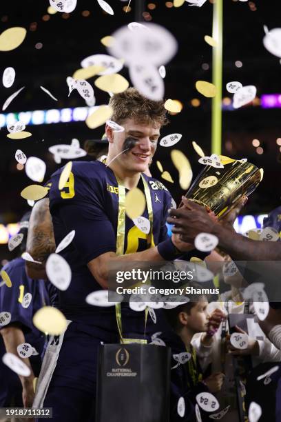 McCarthy of the Michigan Wolverines celebrates after defeating the Washington Huskies during the 2024 CFP National Championship game at NRG Stadium...