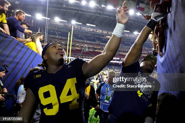 Kris Jenkins of the Michigan Wolverines reacts as he walks to the locker room after defeating the Washington Huskies during the 2024 CFP National...