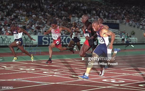 Maurice Greene of the USA scrams in delight as he crosses the line to win the 100 metres final from left to right Tim Montgomery of the USA Ato...