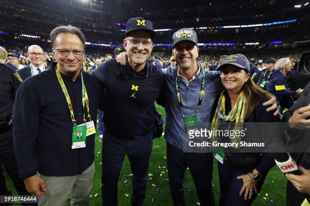Tom Crean, head coach Jim Harbaugh of the Michigan Wolverines poses with his brother, and NFL head coach of the Baltimore Raves, John Harbaugh after...