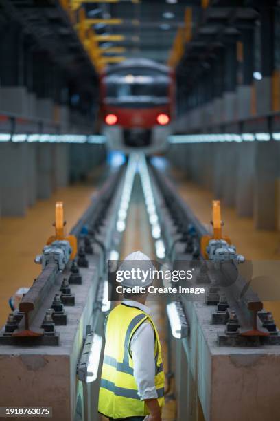 engineer working in railway workshop for engineering industry or transportation concept. - rail engineer stock pictures, royalty-free photos & images