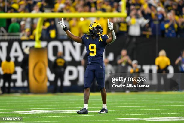 Rod Moore of the Michigan Wolverines gestures during the fourth quarter of the 2024 CFP National Championship game against the Washington Huskies at...