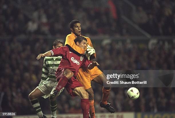 David James the Liverpool goalkeeper tangles with his defender, Stig Inge Bjornebye, during the UEFA Cup first round second leg match against Celtic...