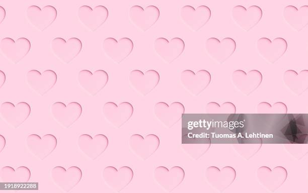 seamless pattern of many pink hearts with paper cutout effect or shadow on a pink background. - roze achtergrond stockfoto's en -beelden
